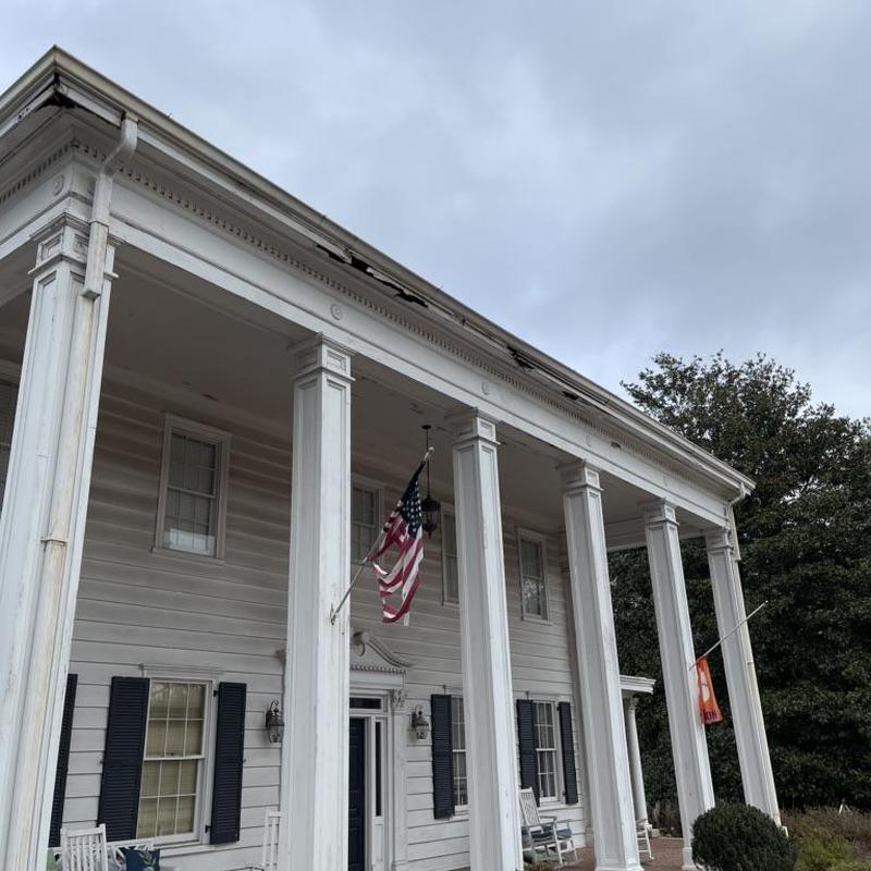 Front columns and gutters on historic facade
