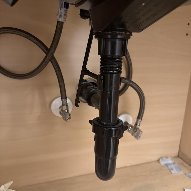 Plastic sink drain trap with braided water supply lines