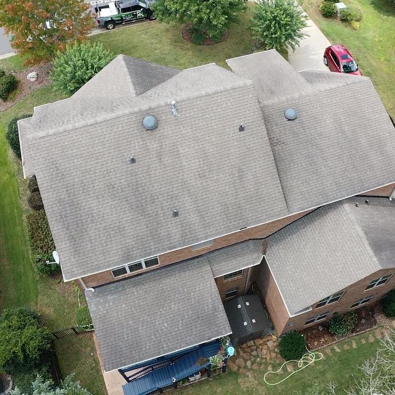 Shingle roof with vents on residential home