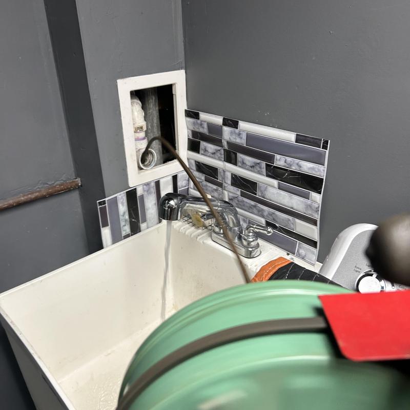 Bathroom sink drain line with plumbing snake inside Bathroom sink drain line with plumbing snake inside