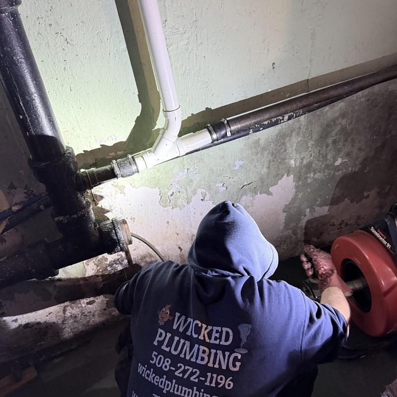 Main sewer pipe blockage clearing with snake tool Main sewer pipe blockage clearing with snake tool