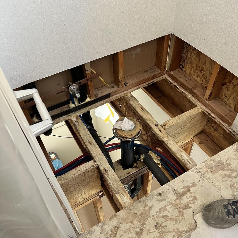 Toilet drain flange and subfloor installation in bathroom