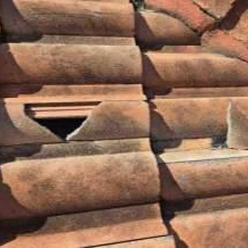 Concrete tile roof with broken tiles