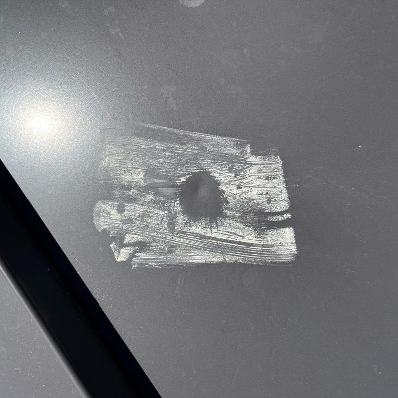 Car roof paint damage with corrosion spot