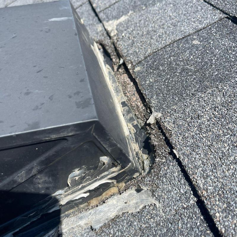 Asphalt shingle roof with damaged flashing sealant