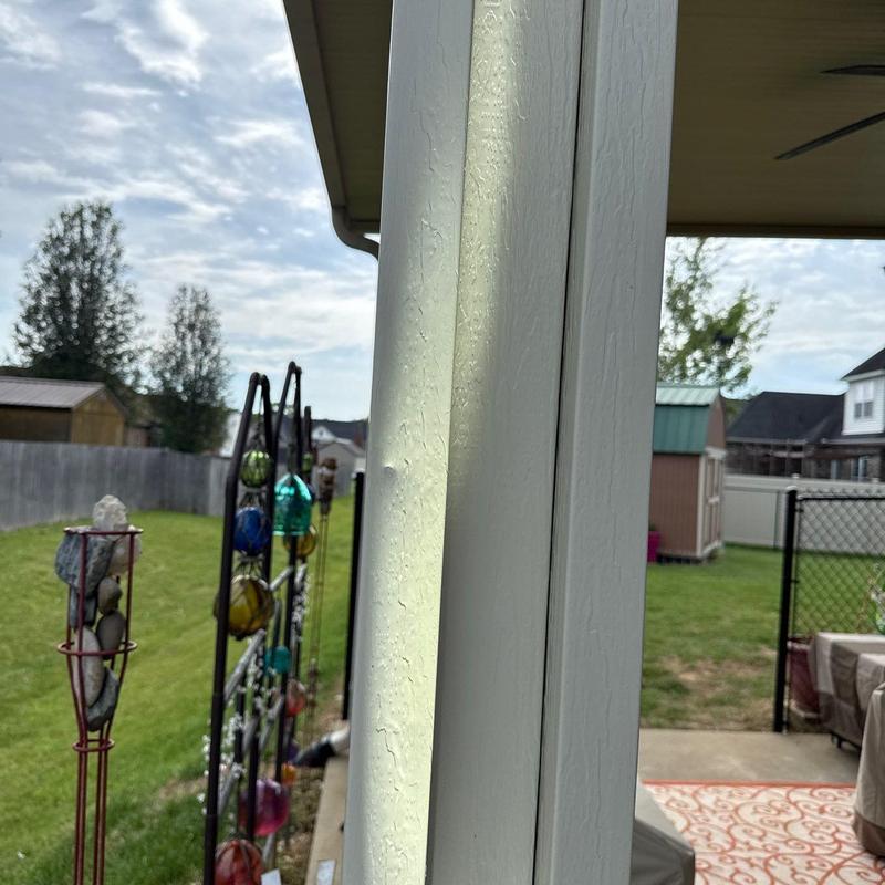 Vinyl siding warping damage on house exterior panel