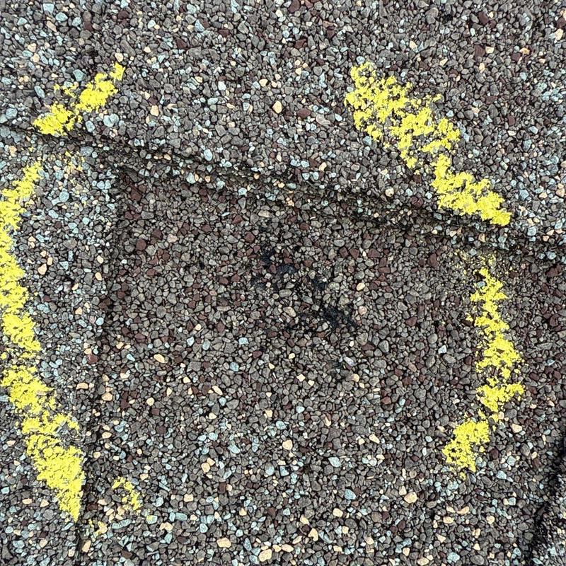 Roof granule loss with yellow marking on asphalt shingles