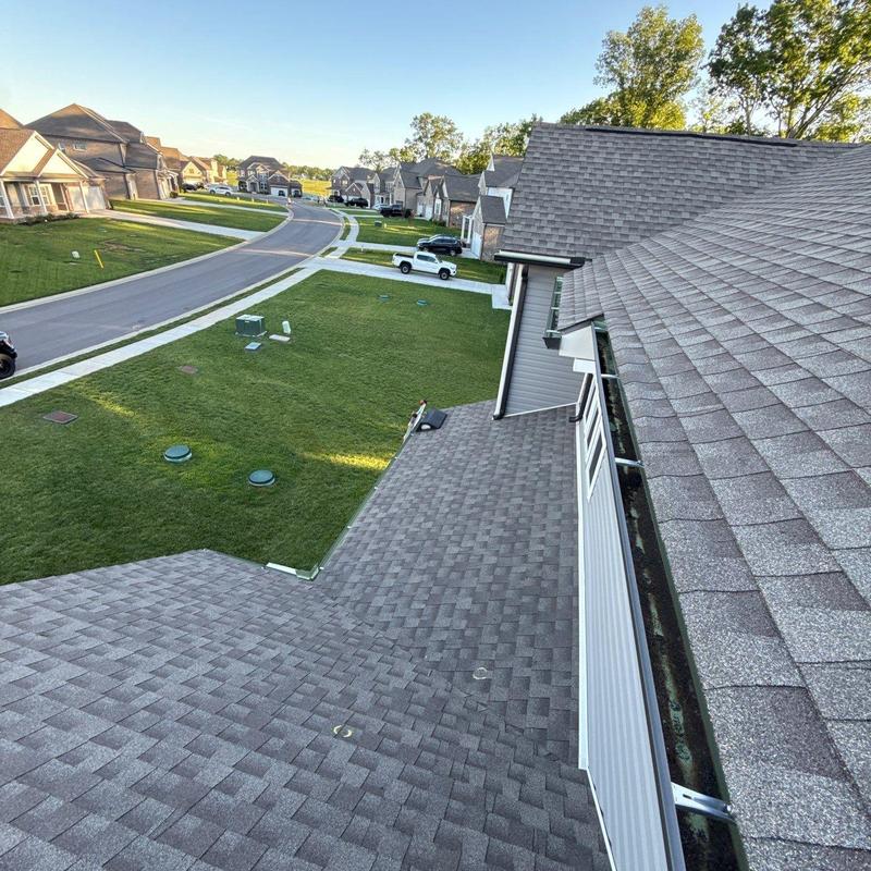 Asphalt shingle roof inspection with ridge vents and gutters