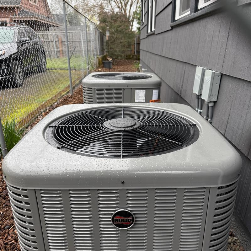 Ruud air conditioner unit installed outside home Ruud air conditioner unit installed outside home