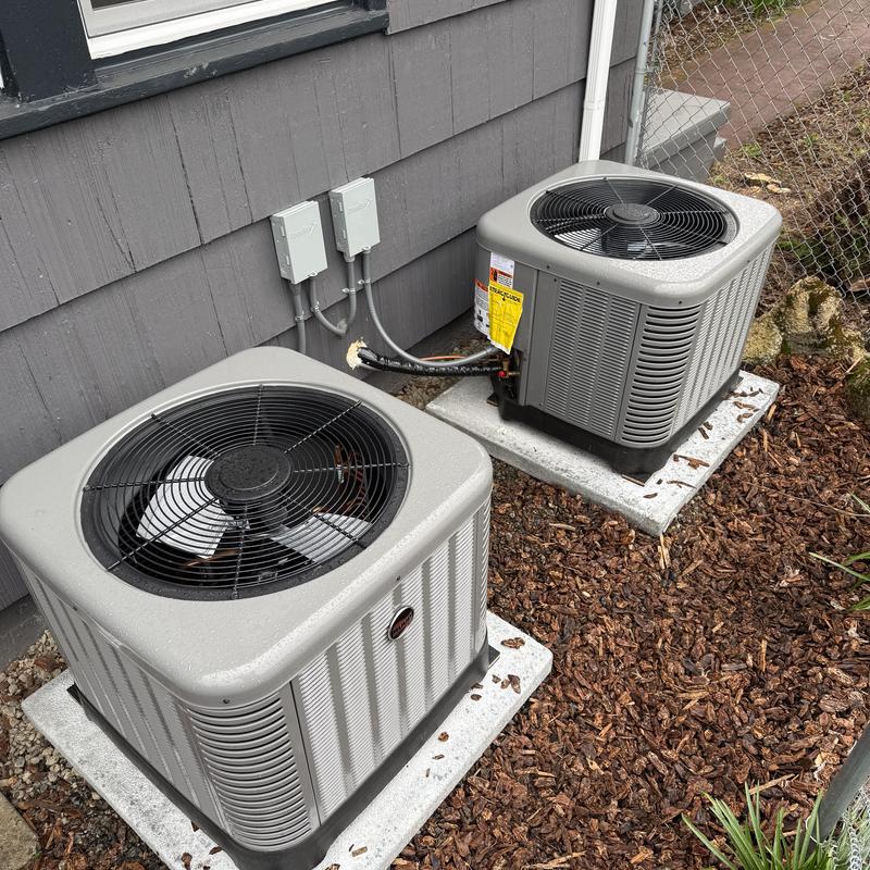 Ruud air conditioner units installed on concrete pads Ruud air conditioner units installed on concrete pads