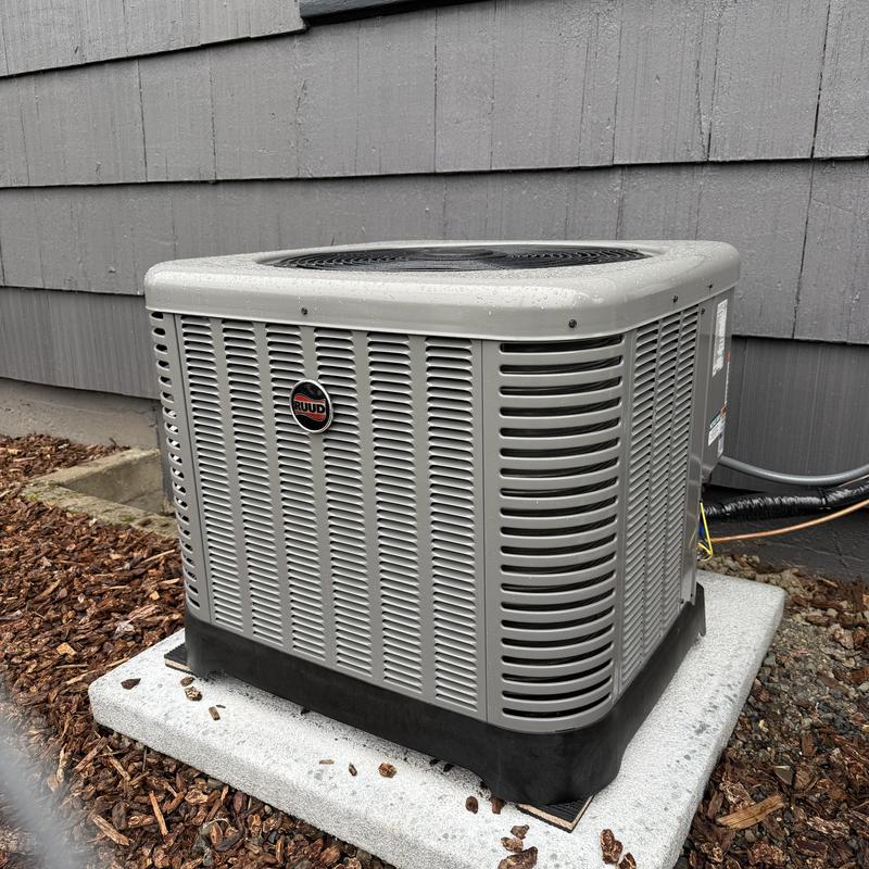 Ruud air conditioner unit installed on concrete pad Ruud air conditioner unit installed on concrete pad