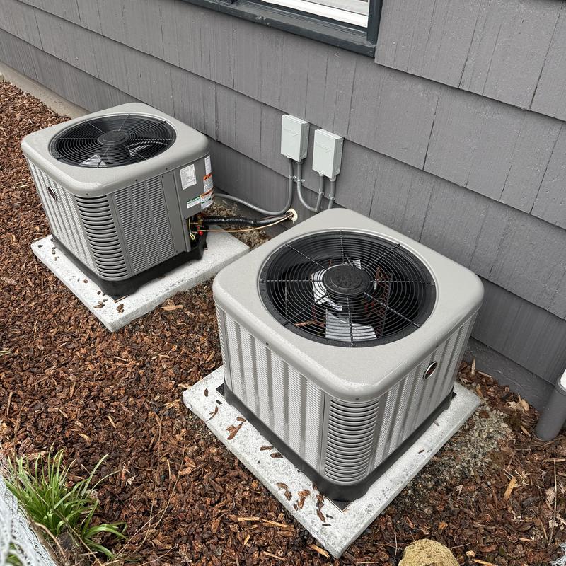 Ruud air conditioner units installed outside home Ruud air conditioner units installed outside home