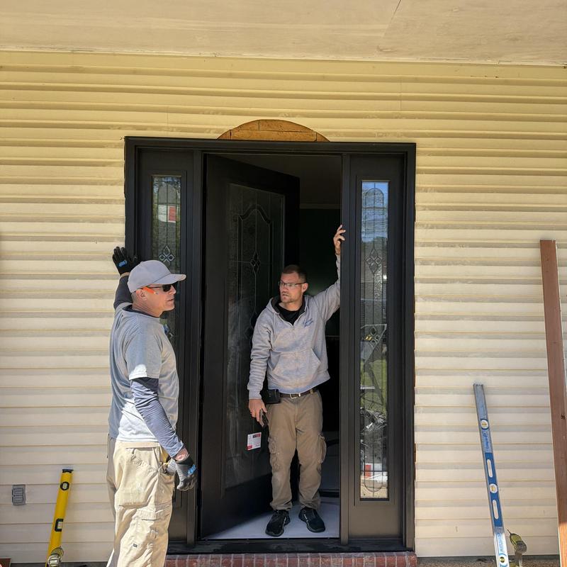 Front door frame installation with sidelights in progress