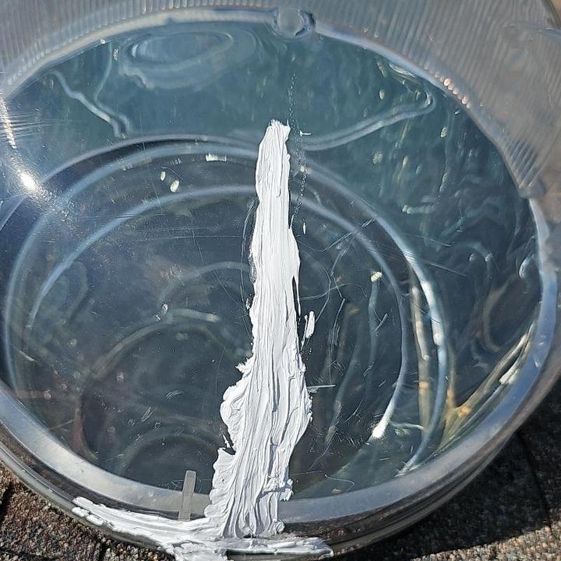 Skylight dome with crack sealed using caulk Skylight dome with crack sealed using caulk