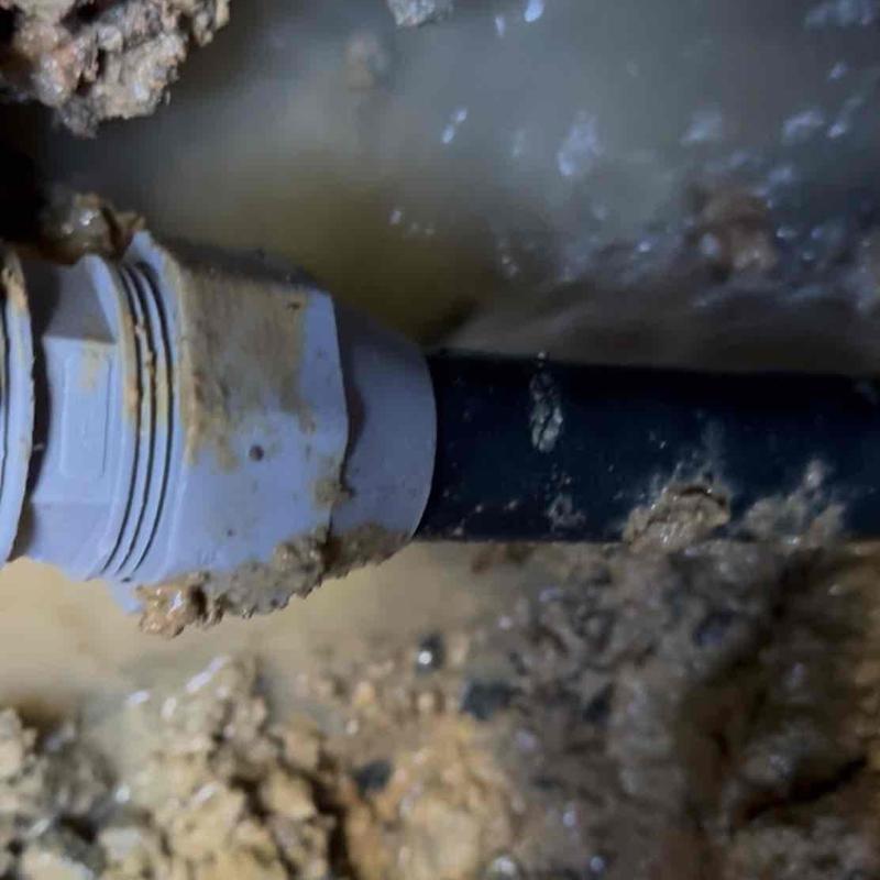 PVC underground pipe with clamp and muddy water PVC underground pipe with clamp and muddy water