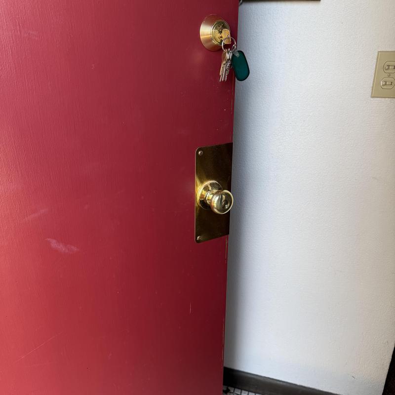 Entry door lock and deadbolt with new wrap plate installed