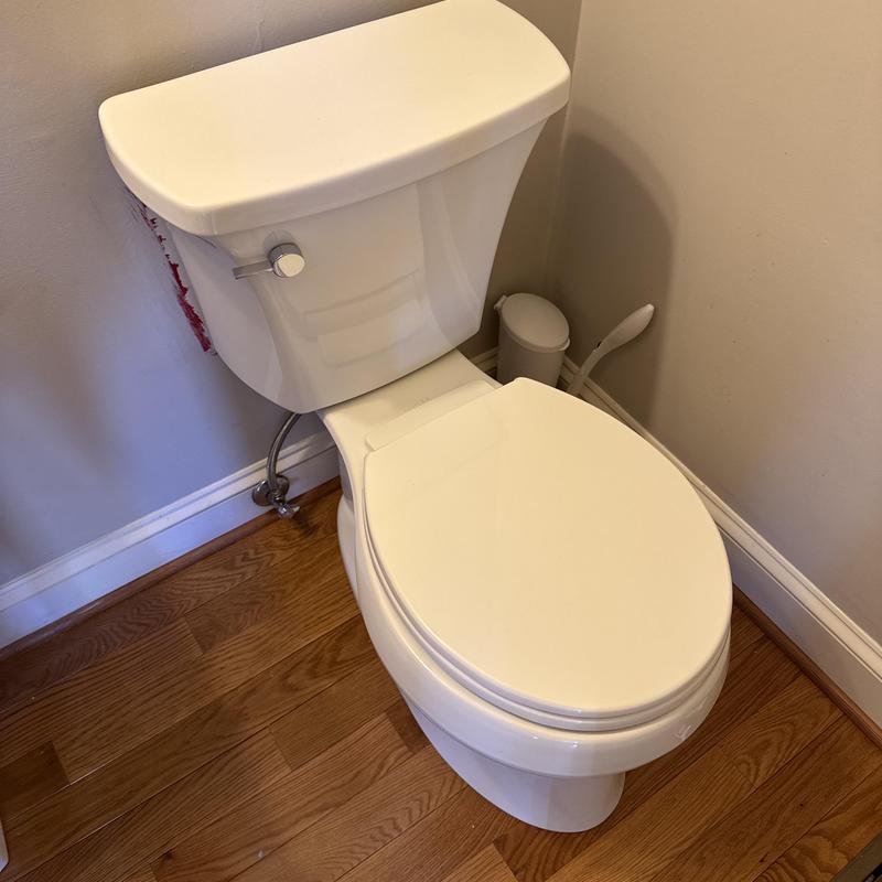 Kohler comfort height toilet installed on hardwood floor