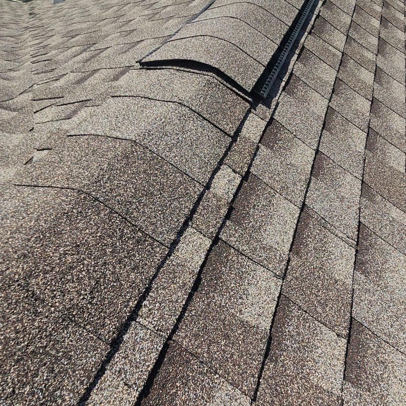Shingle roof with nailed shingles on damaged wood