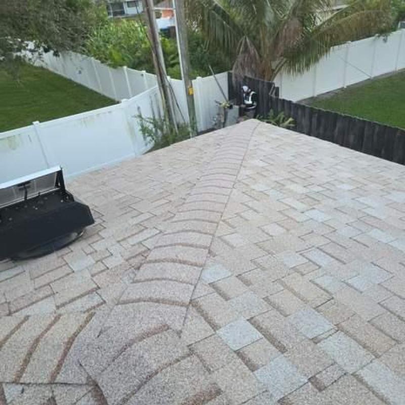 Shingle roof with new ridge cap installation