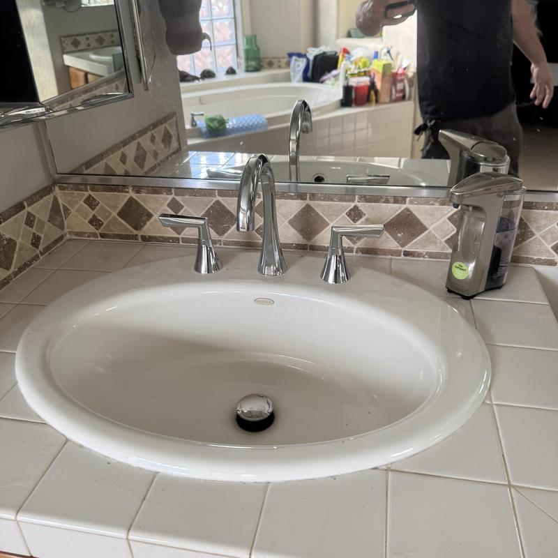 Delta bathroom sink faucet with tiled countertop
