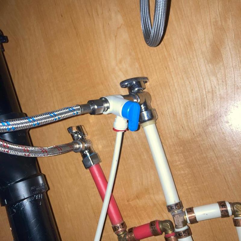 Shutoff valves with supply lines under kitchen sink Shutoff valves with supply lines under kitchen sink
