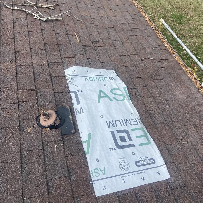 Roof underlayment patch on shingle roof near vent pipe