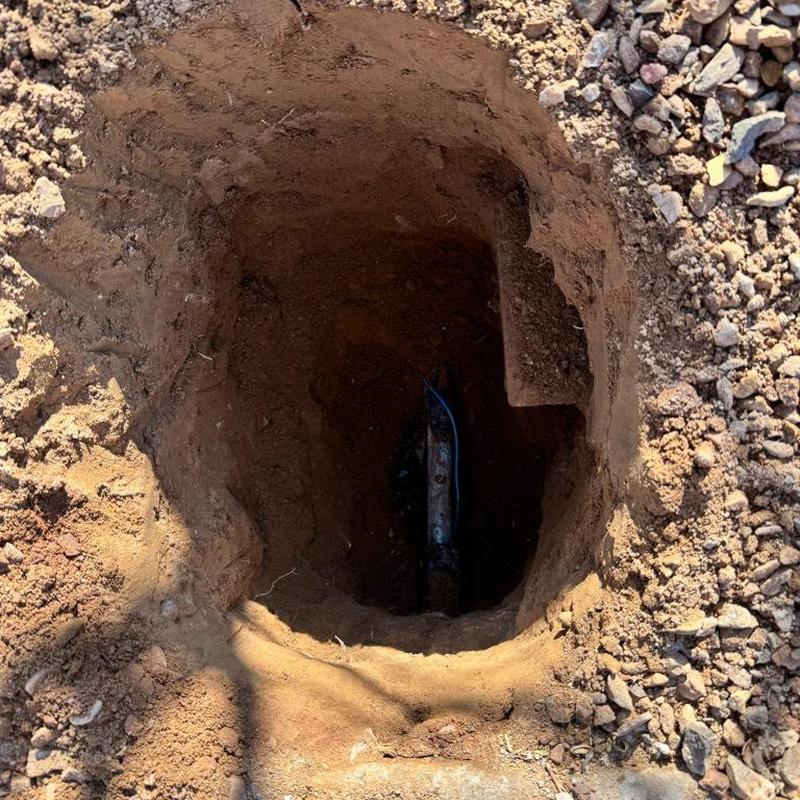 Pressure reducing valve installation with irrigation box hole