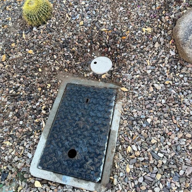 Irrigation box with pressure reducing valve cover in gravel