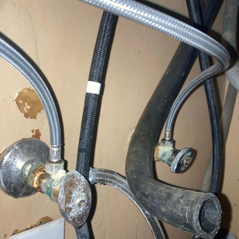 Shut off valves under kitchen sink with hoses