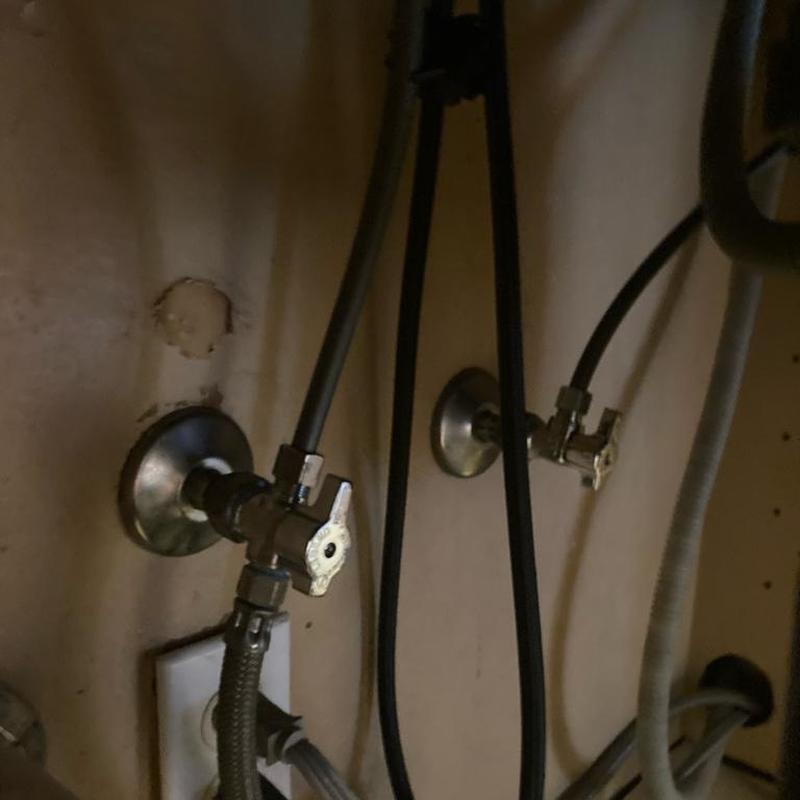 Shut off valves under kitchen sink with hoses