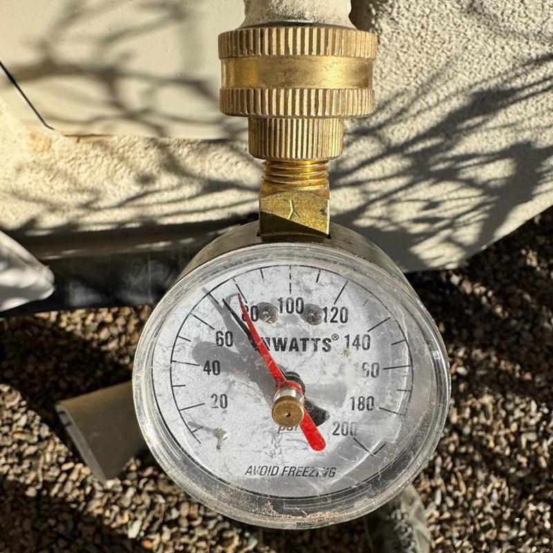 Pressure reducing valve gauge showing water pressure