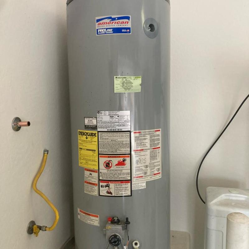 Gas water heater with yellow flex gas line installed