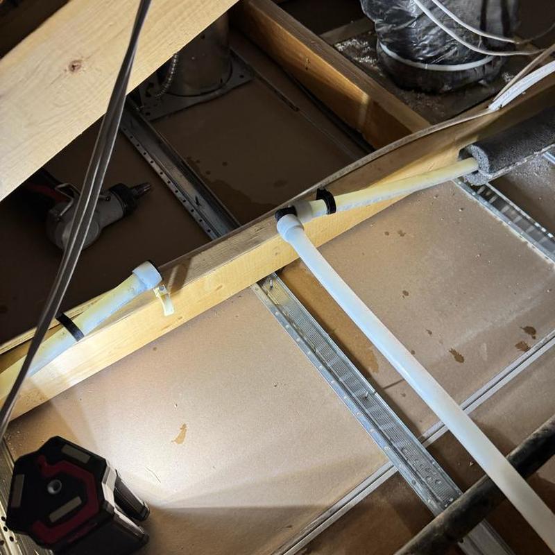 Water heater recirculation pump piping in attic space