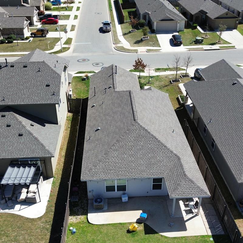 Roof shingles hail damage inspection on residential home Roof shingles hail damage inspection on residential home