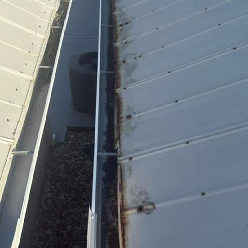 Metal roof panels with rust and corrosion damage