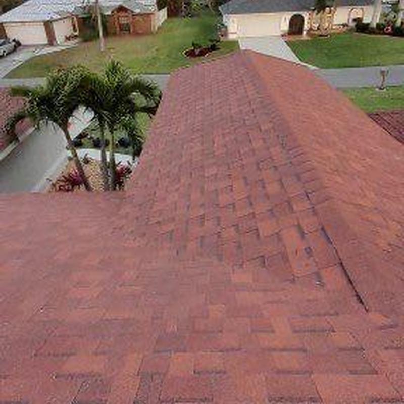 Red architectural shingle roof installation in Cape Coral