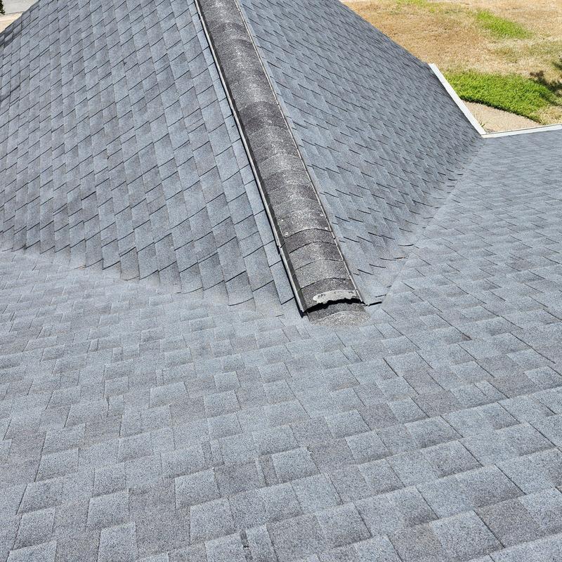 Ridge shingles with granular loss on asphalt roof