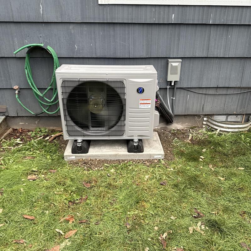 Friedrich heat pump outdoor unit on concrete pad Friedrich heat pump outdoor unit on concrete pad