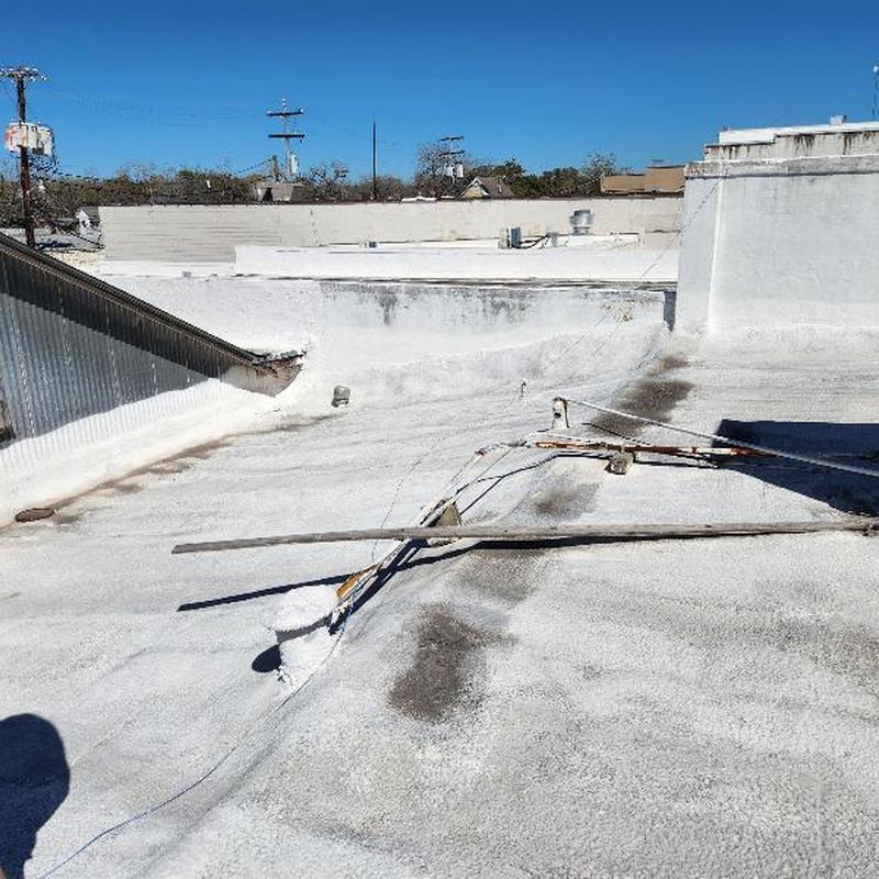 Fiber asphalt roof with holes and leaks visible