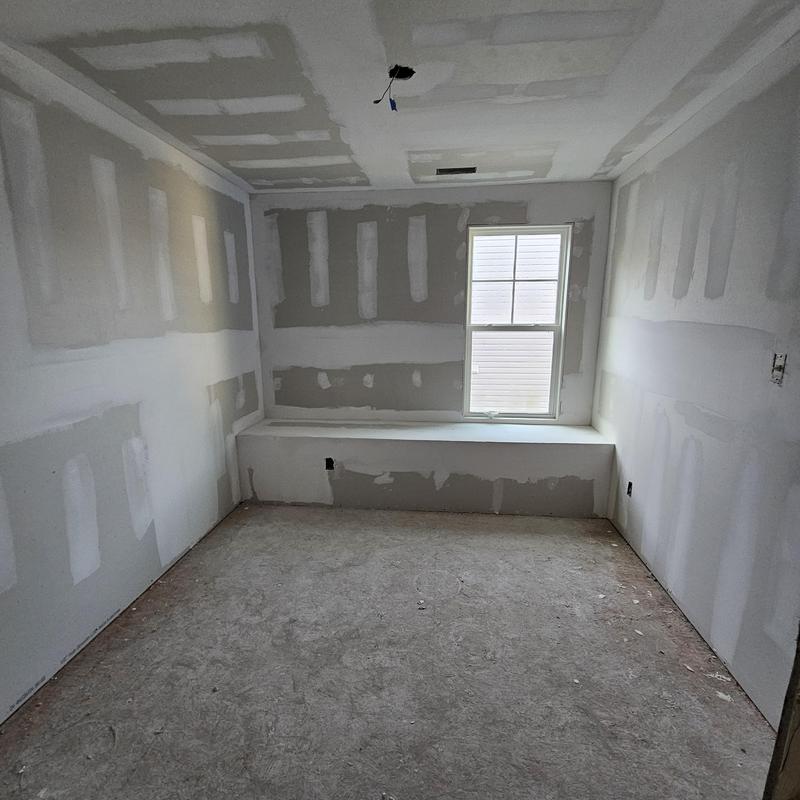 Drywall installation and taping in unfinished room Drywall installation and taping in unfinished room