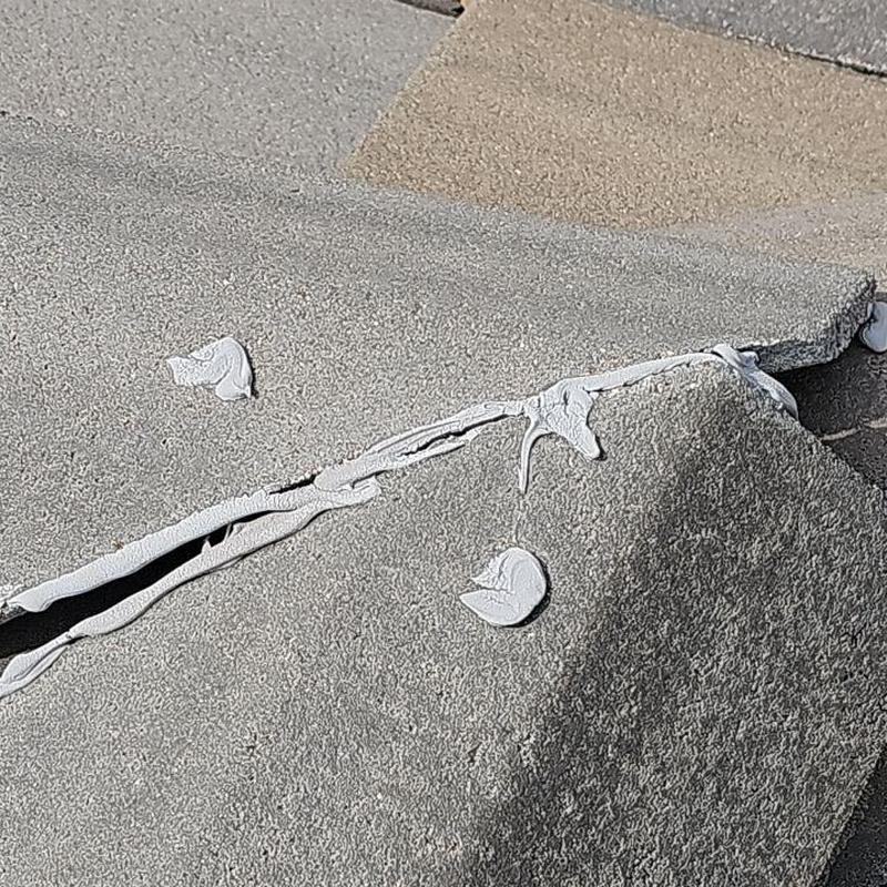 Tile roof ridge connector sealed with roofing cement Tile roof ridge connector sealed with roofing cement