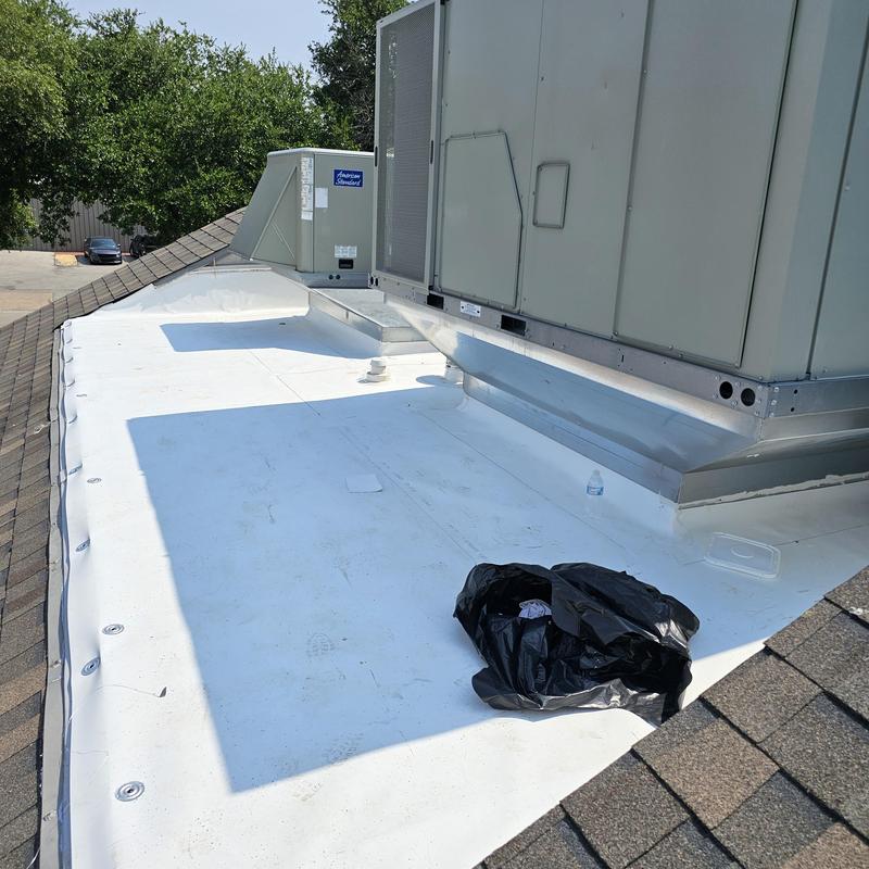 Flat roof membrane near rooftop HVAC unit in Terrell, TX