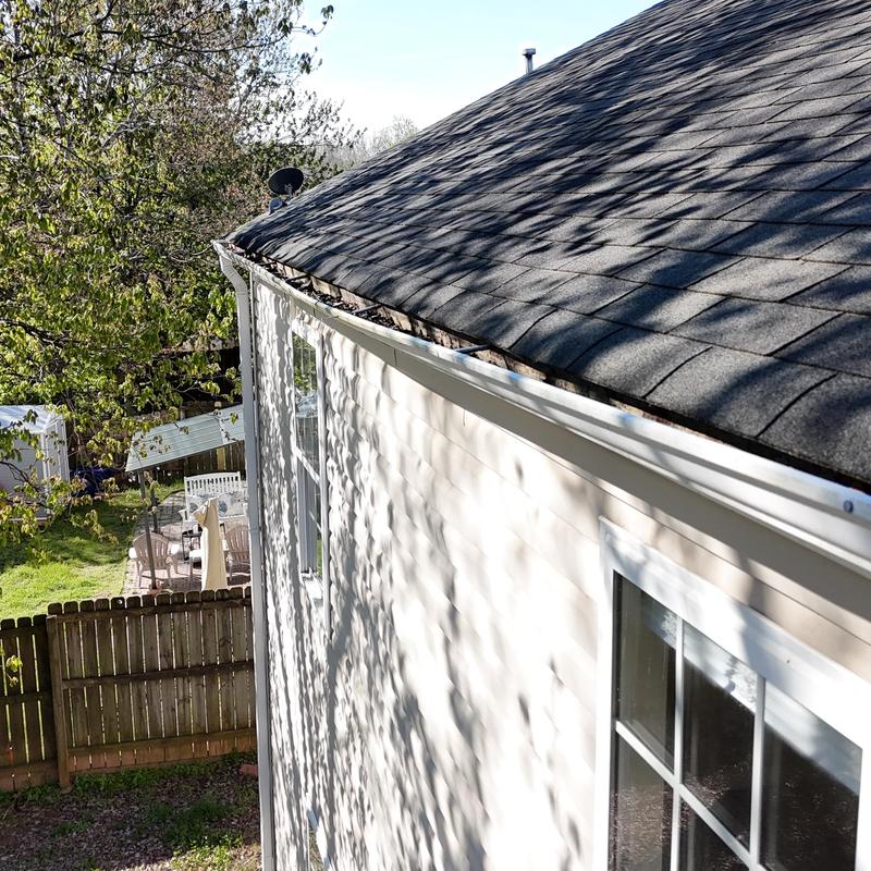 White 5-inch gutters detaching from house edge