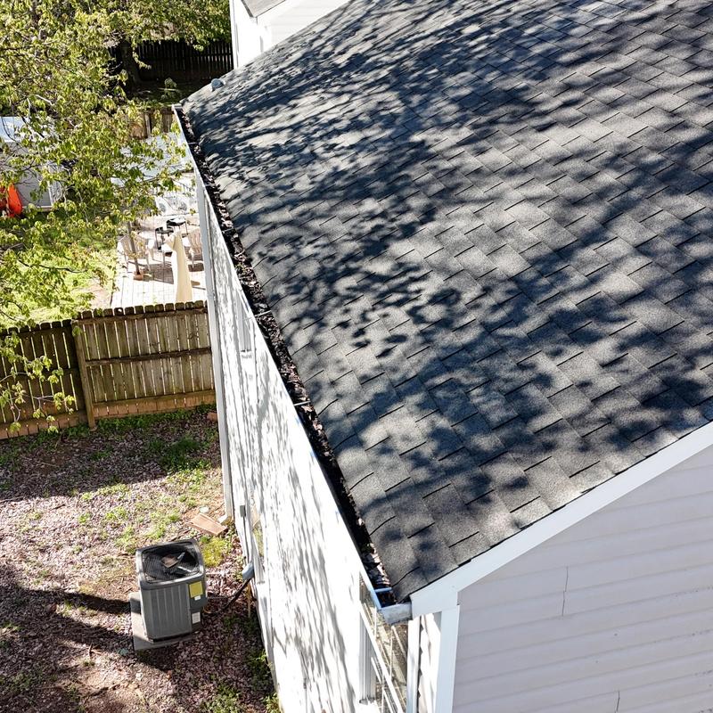 White 5-inch gutters pulling away from house roof edge
