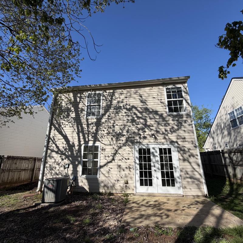 White 5-inch gutters pulling away from two-story house