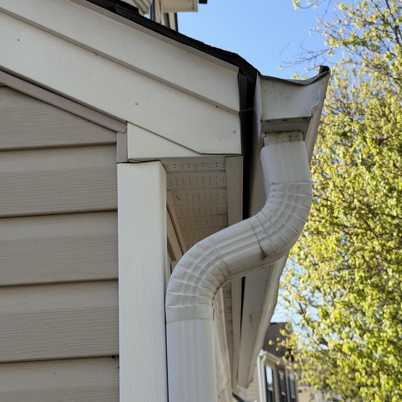 White 5-inch gutters pulling away, overflowing rainwater
