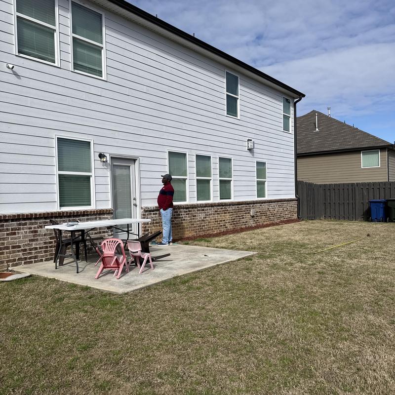 Concrete patio slab with outdoor kitchen and grill pad area planning