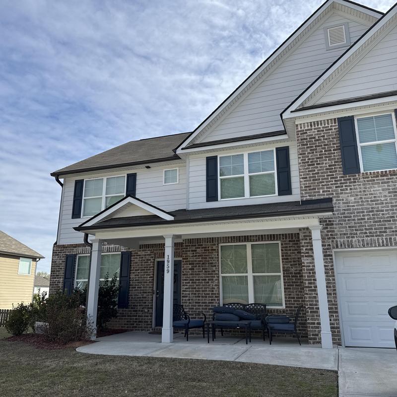 Covered patio and outdoor kitchen area with seating