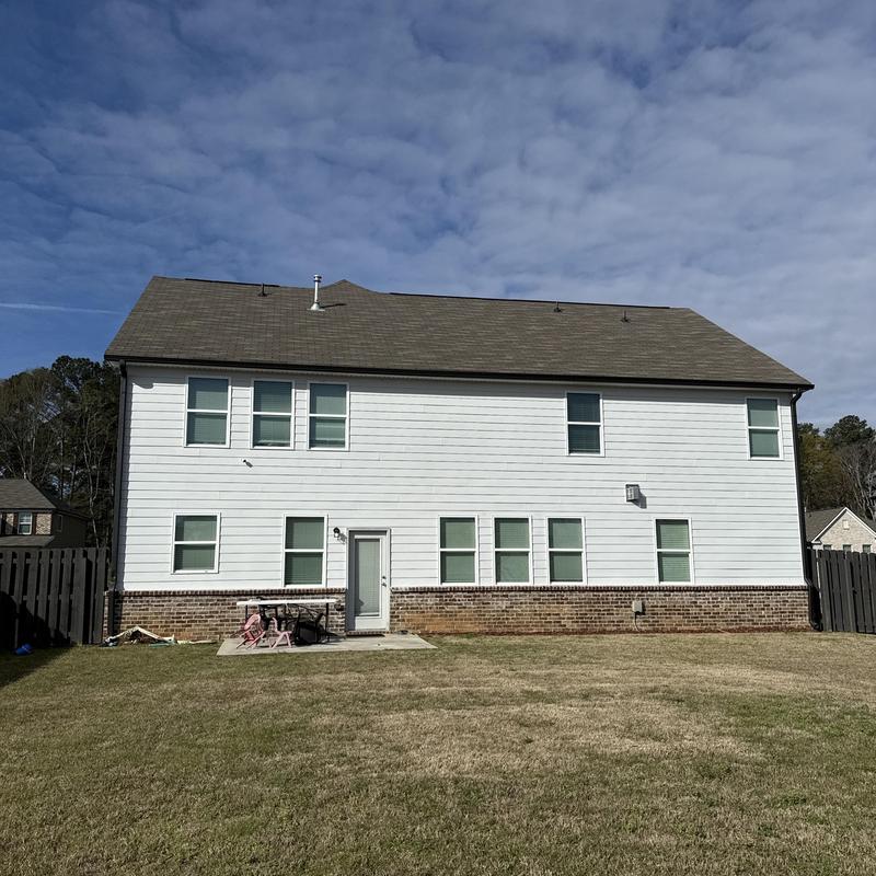 Covered patio with outdoor kitchen pad and ceiling fans