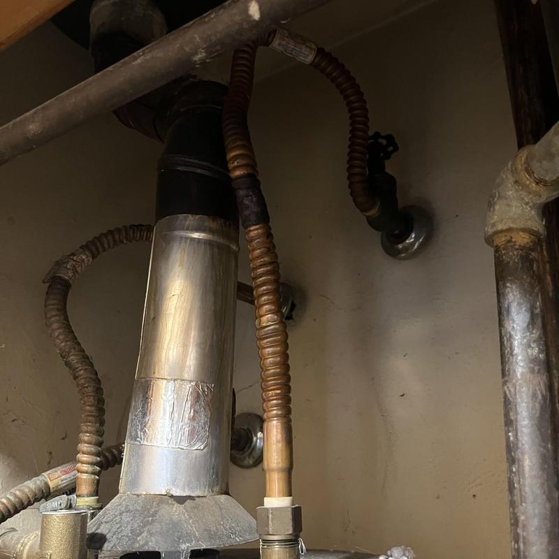 Water heater gas flex lines and vent pipe installation